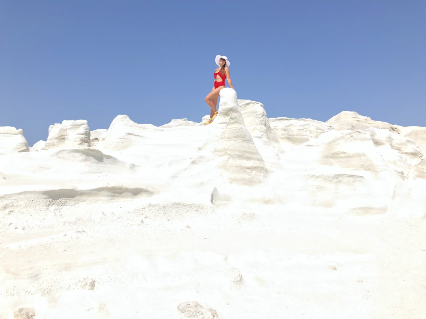 goddess on white volcanic rock beach in Milos island Greece