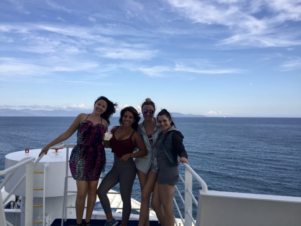 group of women on boat cruise in Greece