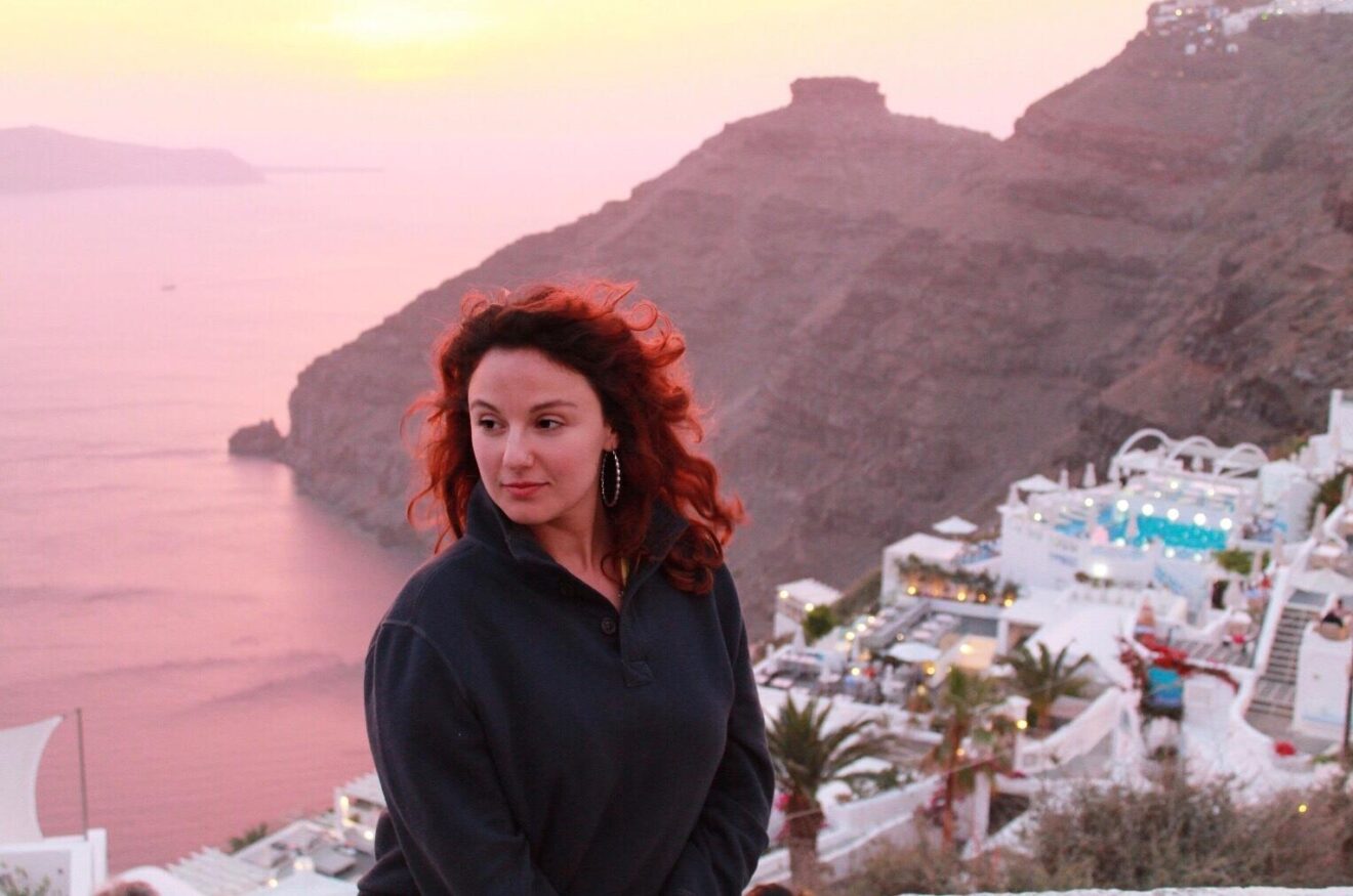 pensive goddess overlooking caldera in Santorini